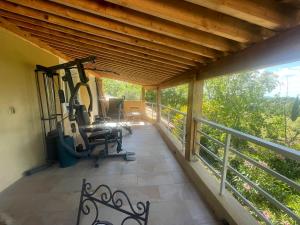 a gym on the balcony of a house at La Bernarde in Tourrettes