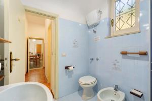 a bathroom with a toilet and a sink at Bella veduta Sun in Agerola +20 photos