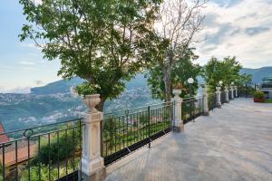 a balcony with a view of a city at Bella veduta Sun in Agerola