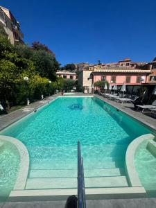 a large swimming pool with blue water at Hotel Due Mari in Sestri Levante