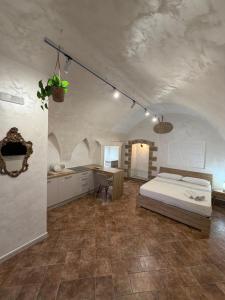 a bedroom with a bed and a desk in a room at Suite16 & spa in Barletta