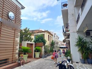 a group of people walking down a street at Apartment Kasper in Skiathos