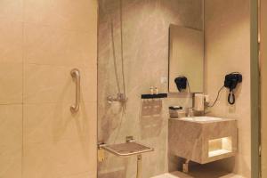 a bathroom with a shower and a sink and a mirror at شقق وسن الفندقية in Abha +83 photos