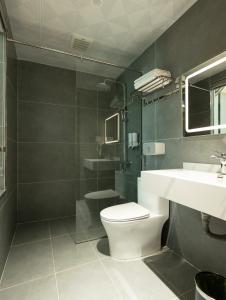 a bathroom with a toilet and a sink at Viet Phuong Center Hotel in Ninh Binh +23 photos