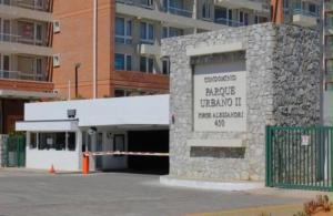 a stone building with a sign on the side of it at Apart bio bio in Concepción