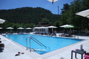 a swimming pool with a slide in the middle at Rum Evi By Secret Sense Collection in Safranbolu