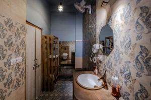 a bathroom with a sink and a mirror at Le Fort Homestay in Jaipur +89 photos