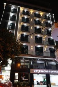 a tall building with lights on top of it at Viet Phuong Center Hotel in Ninh Binh