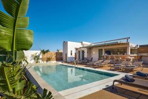 a villa with a swimming pool and a resort at Enorme Epavli Urban Living in Hersonissos