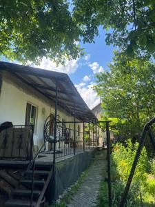 an outside view of a house with a porch at Weekend House in Borjomi