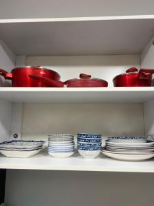 a group of bowls and plates on a shelf at عروس النخيل in Tétouan