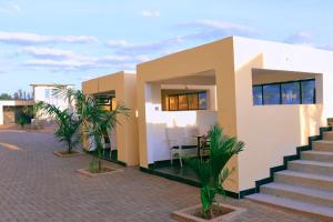 a house with some plants in front of it at The Africana Hotel in Isiolo