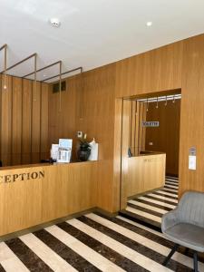 an office lobby with a reception desk and a chair at Amfora-modern apartments with pool in Makarska +139 photos