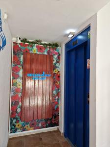 a wall in a hallway with the words end of the world at Apartamentos Wundermar in Torredembarra