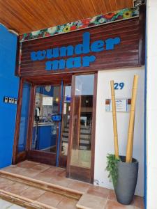 a sandwich maker sign on the front of a building at Apartamentos Wundermar in Torredembarra