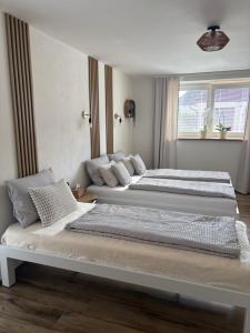 two beds sitting next to each other in a bedroom at Azyl na statku 5 in Pardubice