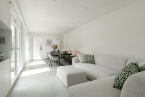 a living room with a couch and a table at Oud Peer in Peer