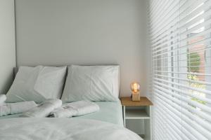 a bedroom with a bed with towels on it at Oud Peer in Peer