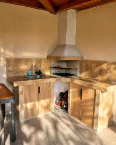 an empty kitchen with a sink and a stove at На Село in Garmen +43 photos