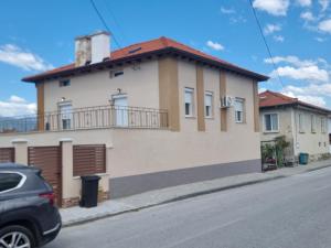 a house on the side of a street at На Село in Garmen