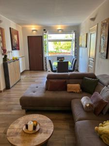 a living room with a couch and a table at Casa Leonardo a Poggi in Imperia