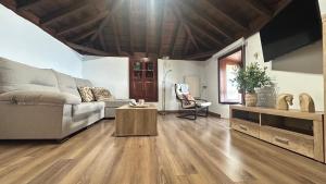 a living room with a couch and a table at Casa Maruca in Puntagorda