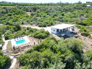 an aerial view of a house with a swimming pool at Ndlovu Addo River Lodge in Kirkwood