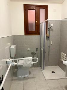 a bathroom with a shower and a toilet and a sink at Casa Vacanze Tridente in Trapani +19 photos