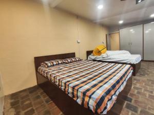 a bedroom with two beds in a room at Sanjhyā Durbar Homestay in Bhaktapur