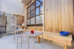 two tables in a room with a window at 千寿宿 玄 in Tokyo +66 photos