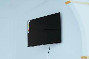 a flat screen tv hanging on a wall at Jaffna Gateway Hotel and Restaurant in Kanakarayankulam