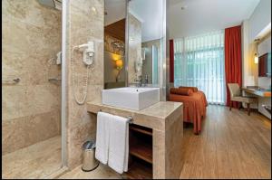 a bathroom with a white sink and a shower at سما تعز in Şīnah +3 photos