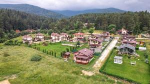 an aerial view of a village with houses on a hill at Къща за гости Дар in Batak