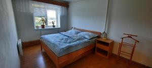 a small bedroom with a bed and a window at Chalupa Lipiny in Nečín +24 photos