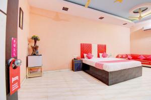 a hotel room with a bed and a couch at 6 CR Hotel Lucky Star CENTRAL BUS STOP in Aurangabad