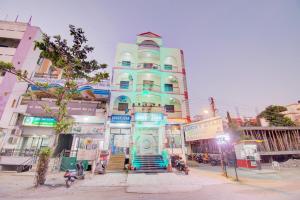 a tall blue building with stairs in front of it at 6 CR Hotel Lucky Star CENTRAL BUS STOP in Aurangabad
