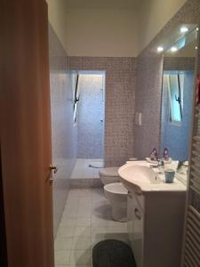 a bathroom with a sink and a toilet and a shower at Casa Sirente, Via Monte Sirente n 51 in Francavilla al Mare