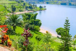 a view of a beach and a body of water at Mariebu Beach Resort in Buhongo