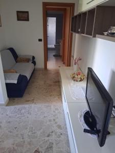 a living room with a flat screen tv on a counter at Casa Sirente, Via Monte Sirente n 51 in Francavilla al Mare