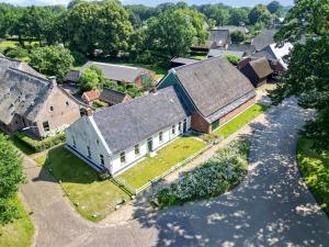 an aerial view of an old farm house at Het Schultehuis in Anloo