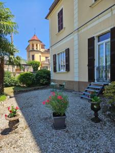 a building with potted plants in front of it at Vista Lago in Luino