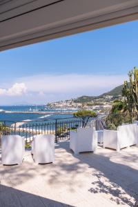 a view of the ocean from the balcony of a house at Hotel L'Approdo in Casamicciola Terme