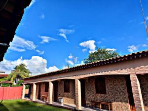 a building with a blue sky in the background at Pousada Açaí in Salvaterra +2 photos