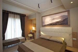 En eller flere senge i et værelse på Hotel C'era Una Volta