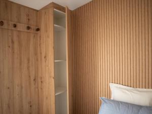 a bedroom with a book shelf next to a bed at Casa 4 Peixes in Leiria