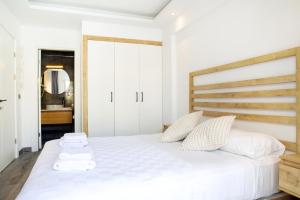 a bedroom with a large white bed with two pillows at Sör Apart Otel in Bodrum City