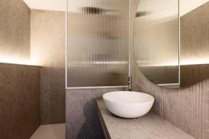 a bathroom with a bowl sink and a mirror at Can Miquel in L'Escala +51 photos