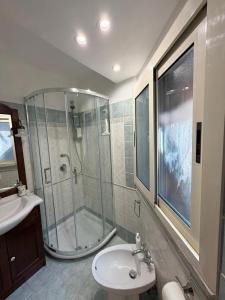 a bathroom with a shower and a sink at Casa del Borgo, between Mountains and Lake, Near Rome in Canepina +14 photos