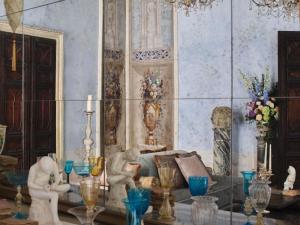 a room with a couch and a table with vases at Orient Express Venezia in Venice