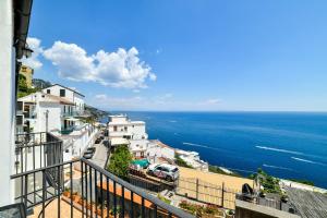a view of the ocean from a balcony at Terrazza di Rosa - sea view in Praiano